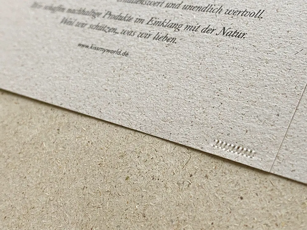 Banderole aus Graspapier für den Notizblock aus Naturpapier.